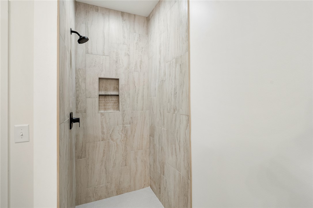 125 Cambridge Lane Pendleton, SC 29670 - Photo 13 of 22 This sleek shower features modern fixtures and textured tile for a clean aesthetic.