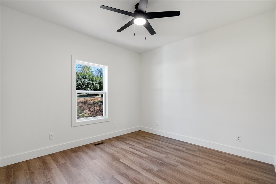 125 Cambridge Lane Pendleton, SC 29670 - Photo 16 of 22 This bright room features beautiful flooring and abundant natural light.