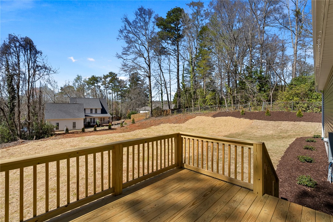 125 Cambridge Lane Pendleton, SC 29670 - Photo 18 of 22 Enjoy outdoor living on this spacious deck overlooking a verdant backyard.