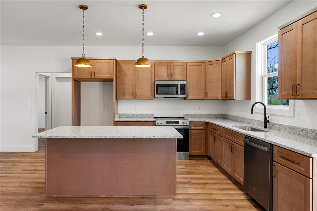 125 Cambridge Lane Pendleton, SC 29670 - Photo 6 of 22 This bright kitchen features ample cabinetry, spacious countertops, and modern appliances perfect for daily living.