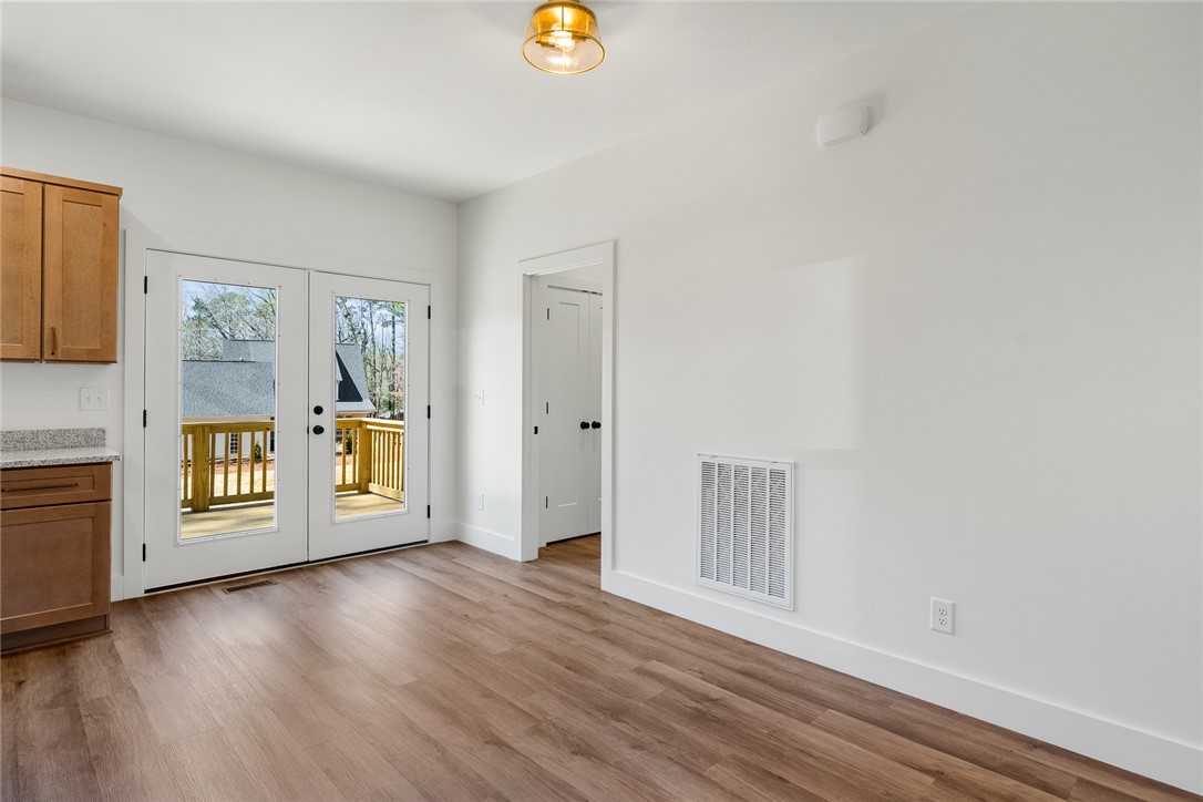 125 Cambridge Lane Pendleton, SC 29670 - Photo 9 of 22 This bright space features natural light, sleek flooring, and a private deck, offering effortless indoor-outdoor living.