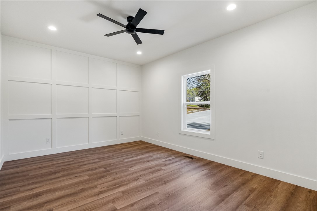125 Cambridge Lane Pendleton, SC 29670 - Photo 10 of 22 This bright room features durable flooring and contemporary lighting, offering versatile living space.