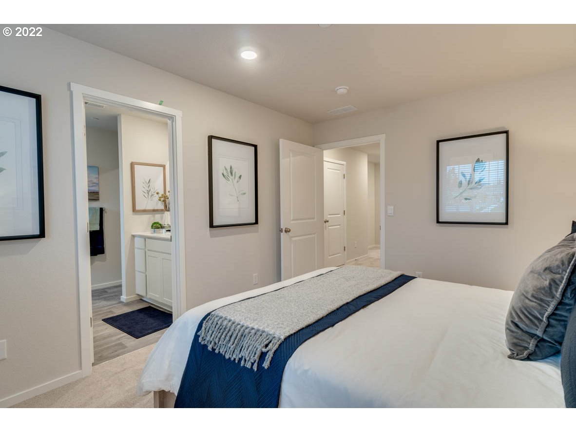 218 North Layla Place Ridgefield, WA 98642 - Photo 25 of 38 a bedroom with a bed and a view of bathroom
