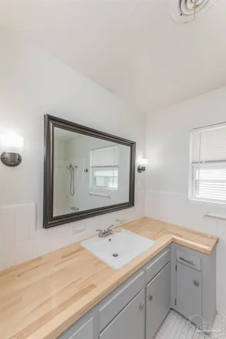 a bathroom with a sink and a mirror