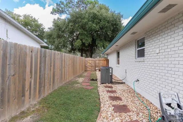 a balcony with table and chairs