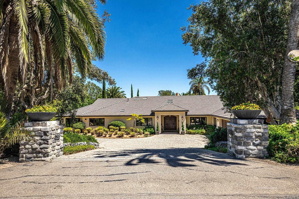 6103 Mimulus Rancho Santa Fe, CA 92067 - Photo 1 of 19 a front view of a house with a yard