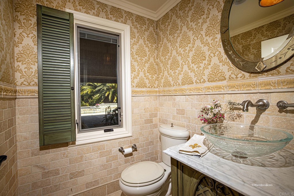 6103 Mimulus Rancho Santa Fe, CA 92067 - Photo 12 of 19 a bathroom with a granite countertop sink and a mirror