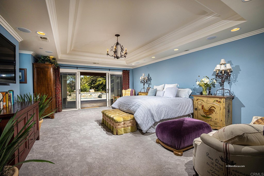 6103 Mimulus Rancho Santa Fe, CA 92067 - Photo 14 of 19 a spacious bedroom with bed and a couch