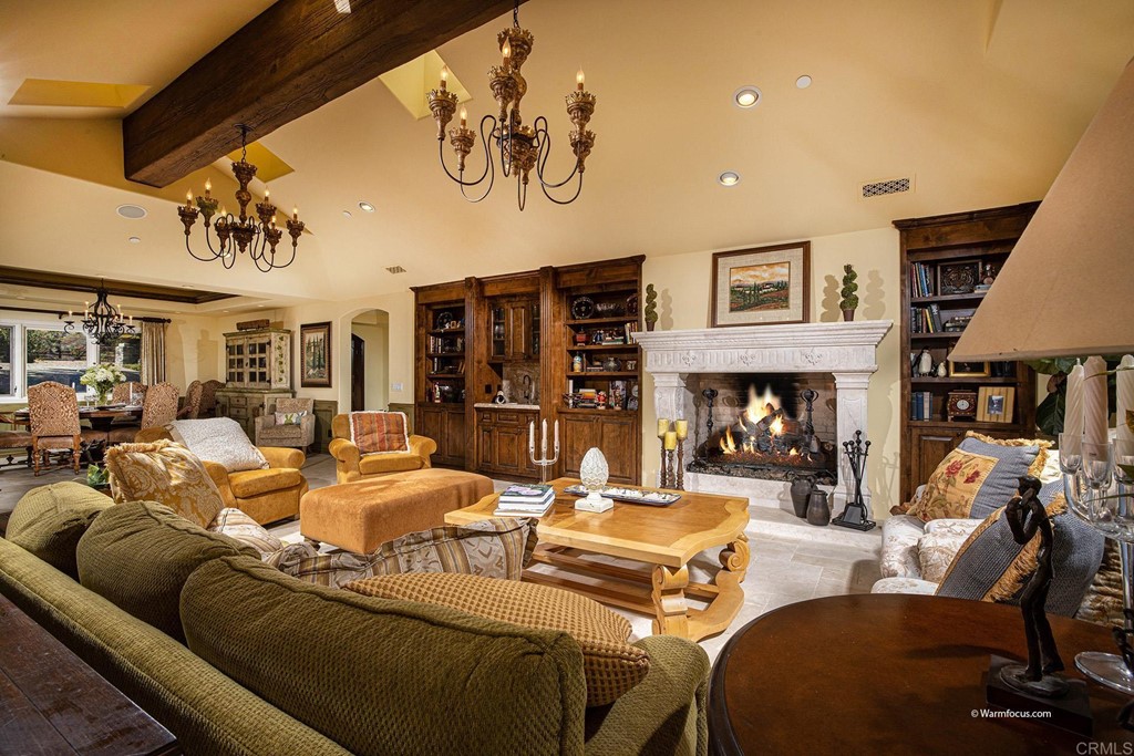 6103 Mimulus Rancho Santa Fe, CA 92067 - Photo 3 of 19 a living room with furniture and a fireplace