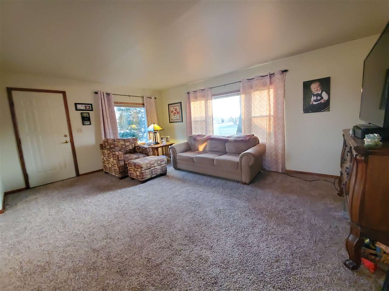 14375 West Springdale Road Forreston, IL 61030 - Photo 15 of 39 a living room with furniture and a flat screen tv
