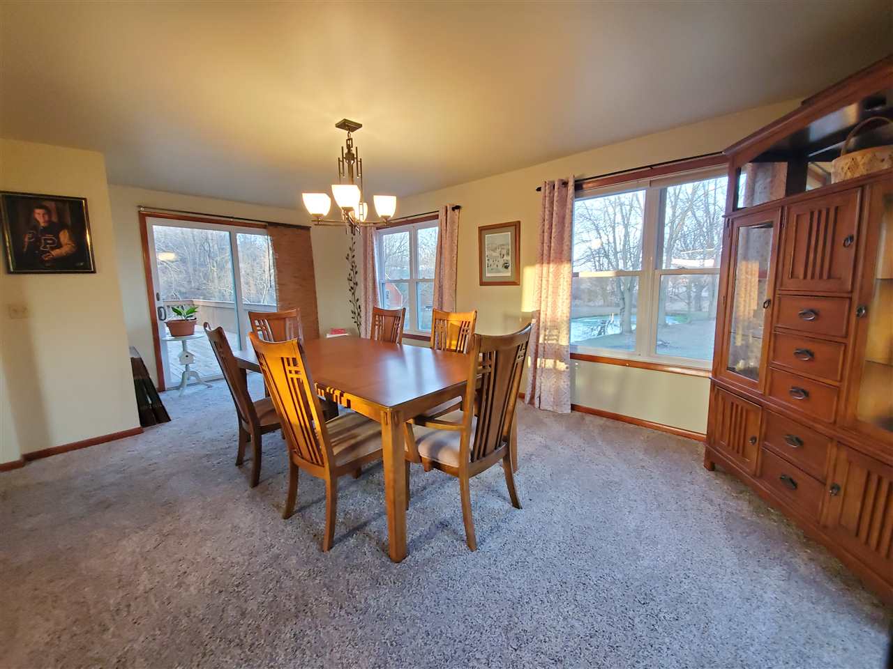 14375 West Springdale Road Forreston, IL 61030 - Photo 17 of 39 a view of a dining room with furniture and chandelier