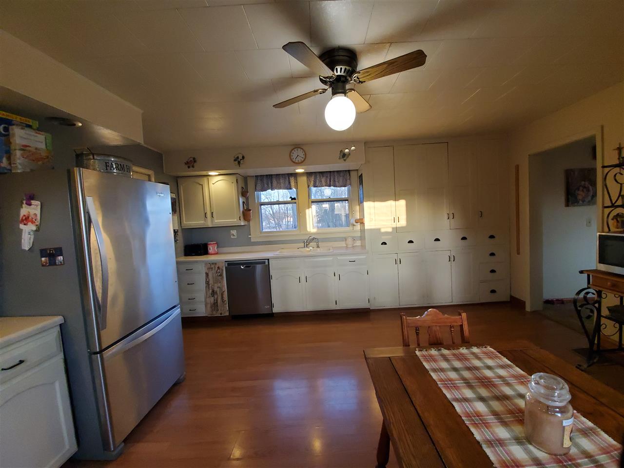 14375 West Springdale Road Forreston, IL 61030 - Photo 21 of 39 a kitchen with cabinets a sink stainless steel appliances and a window