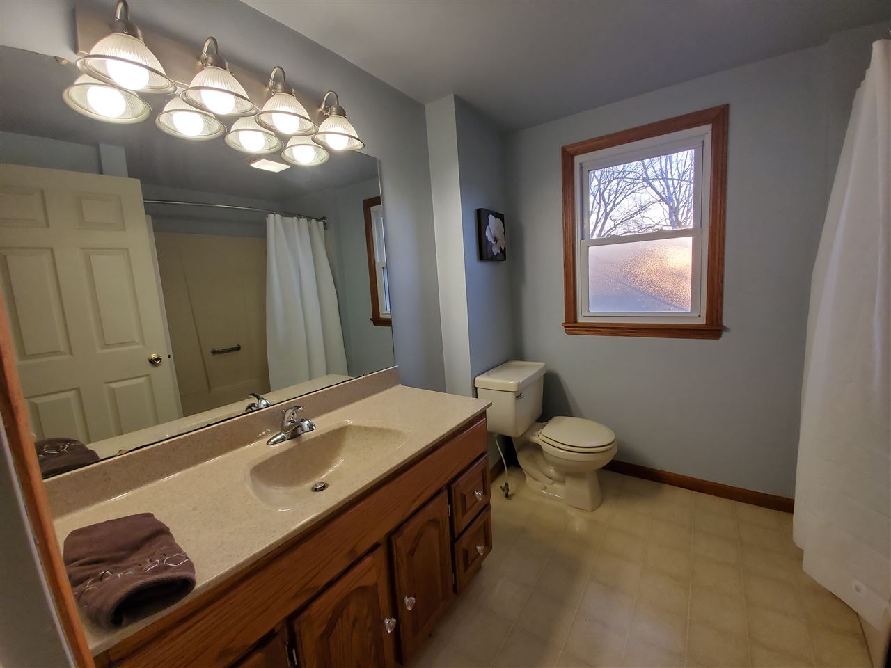 14375 West Springdale Road Forreston, IL 61030 - Photo 4 of 39 a bathroom with a toilet sink and mirror