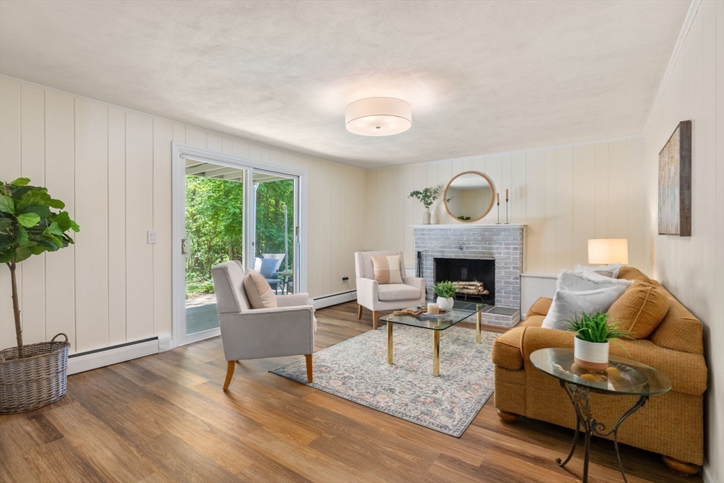 11 Longmeadow Road Medfield, MA 02052 - Photo 23 of 39 a living room with furniture and a fireplace