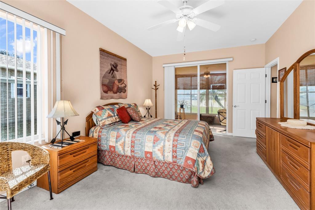 24116 Buckingham Way Punta Gorda, FL 33980 - Photo 13 of 42 a bedroom with bed and window