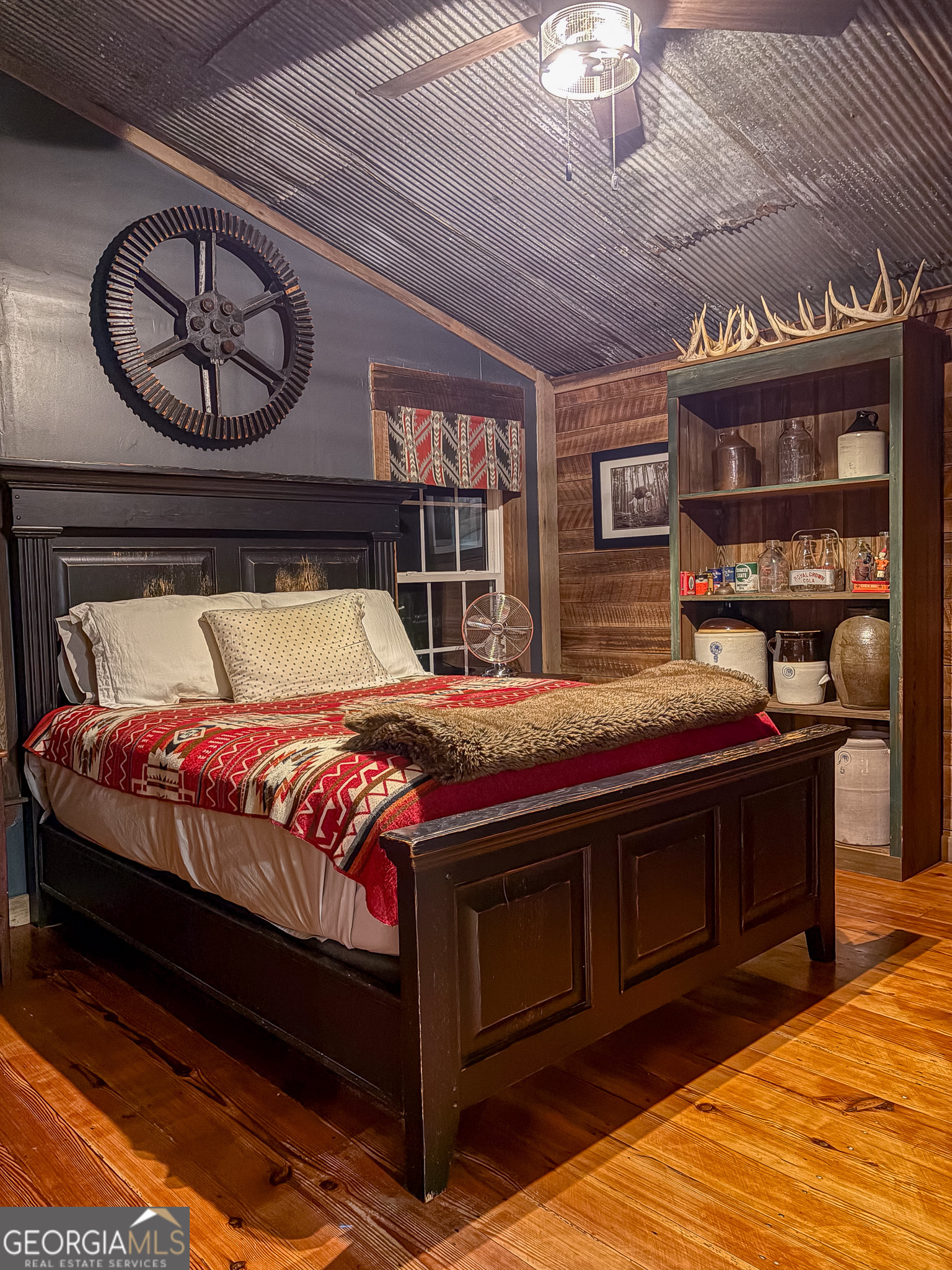 105 Buchanan Road Americus, GA 31719 - Photo 12 of 25 a bed sitting in a bedroom next to a building