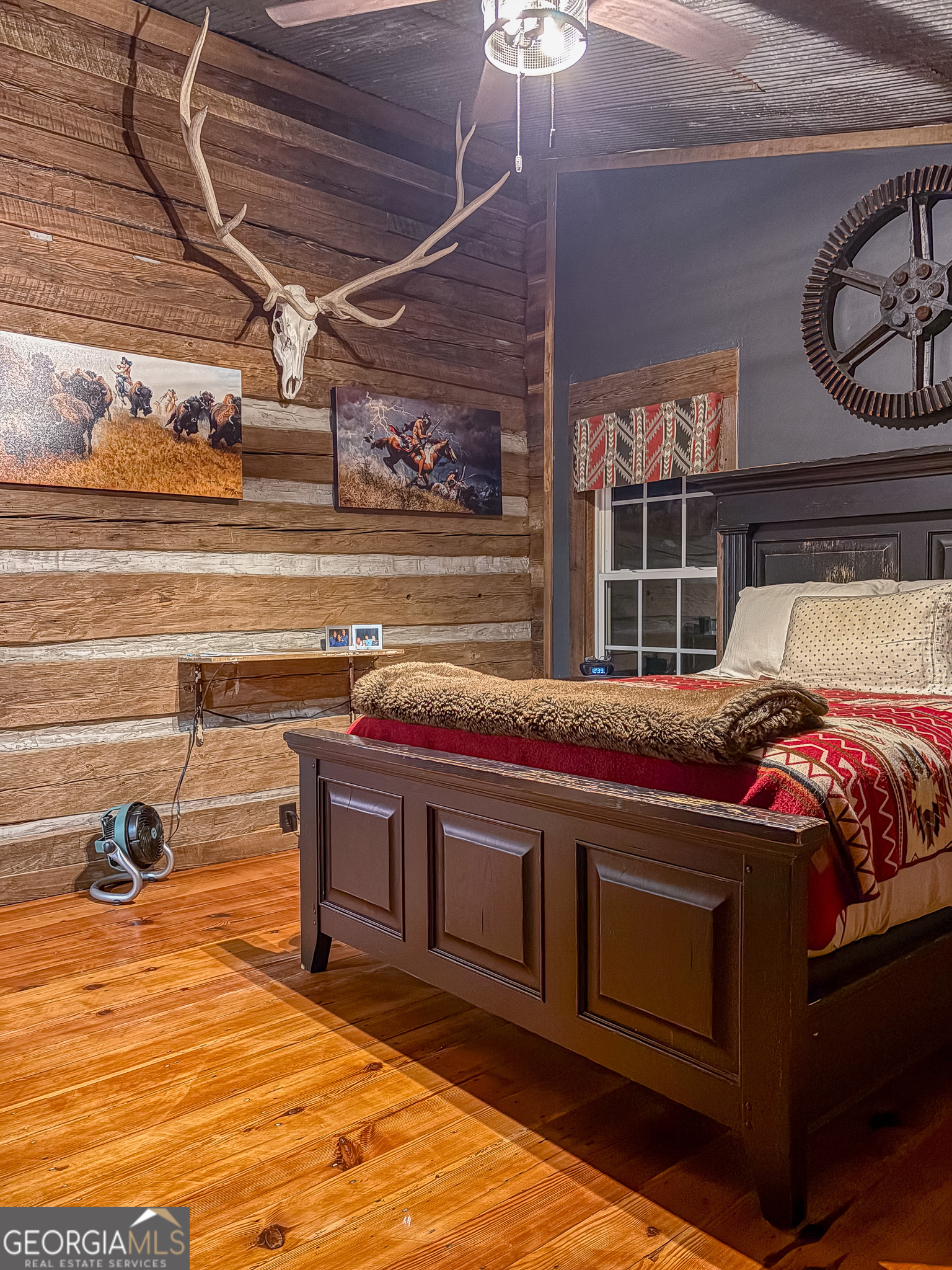 105 Buchanan Road Americus, GA 31719 - Photo 14 of 31 a bedroom with a bed and wooden floor