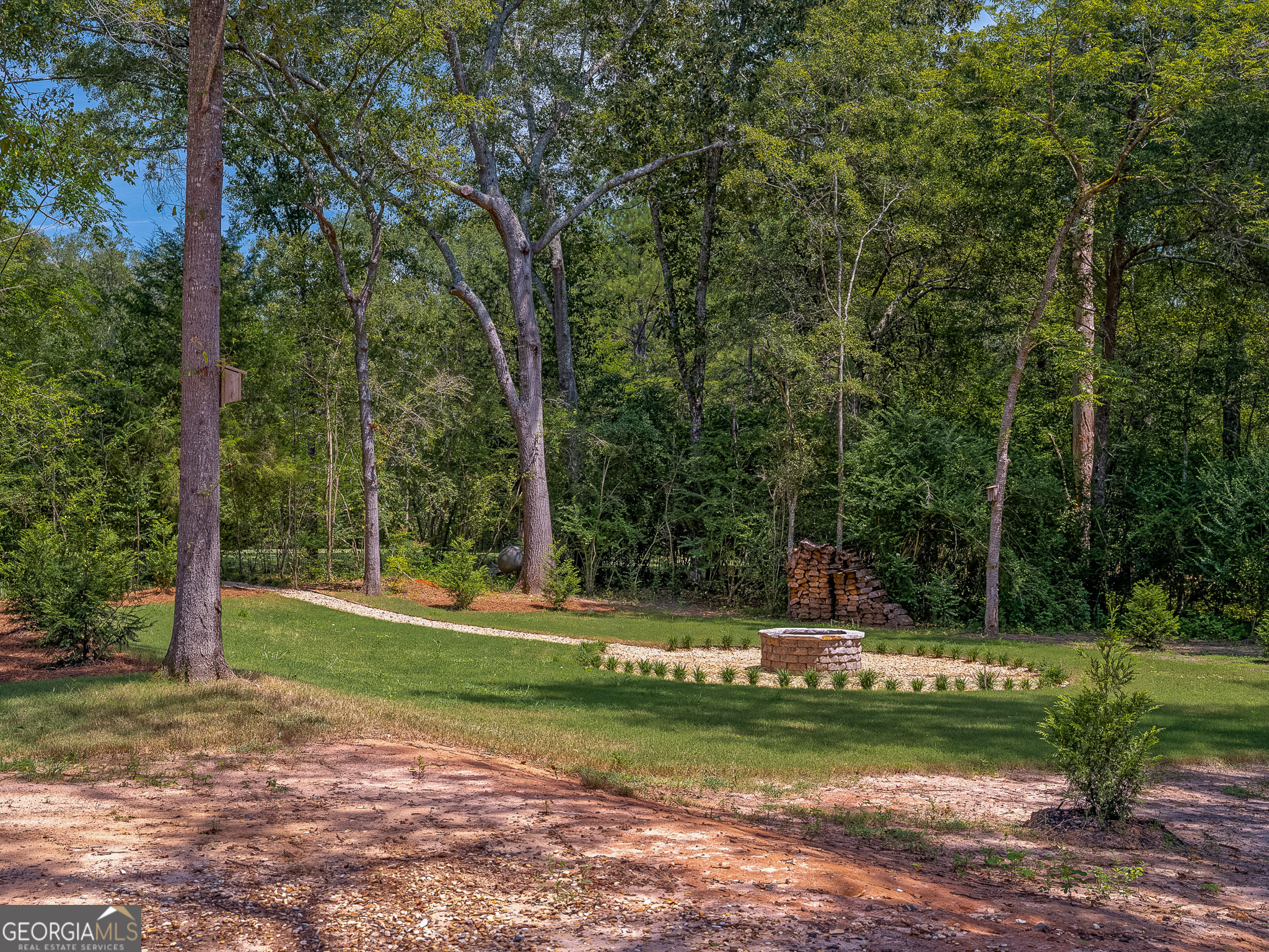 105 Buchanan Road Americus, GA 31719 - Photo 2 of 25 a garden view with a fountain