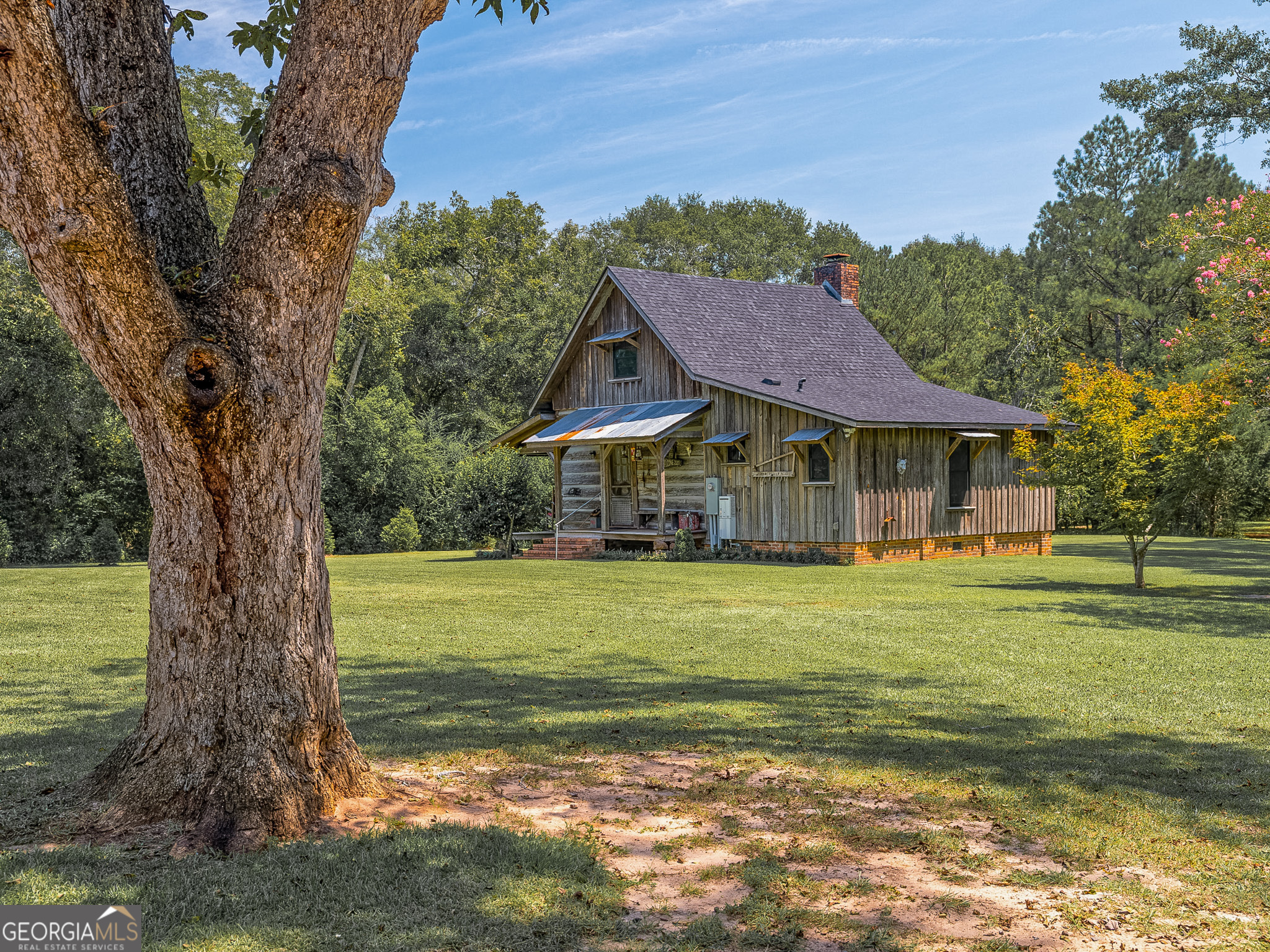105 Buchanan Road Americus, GA 31719 - Photo 5 of 25 a front view of a house with a garden