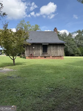 a kitchen with stainless steel appliances granite countertop a sink and wooden cabinets