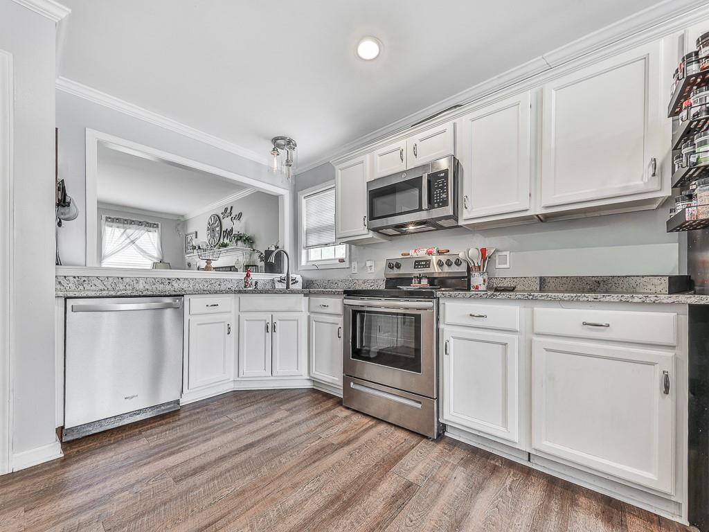 68 Arbor Hills Road South Talking Rock, GA 30175 - Photo 2 of 36 a kitchen with granite countertop white cabinets white stainless steel appliances and sink