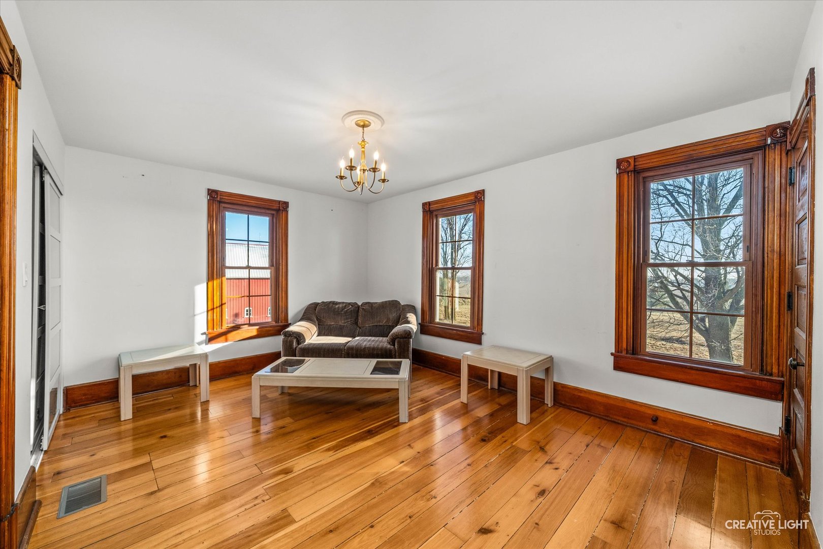 10256 Somonauk Road Hinckley, IL 60520 - Photo 13 of 44 a living room with furniture and wooden floor