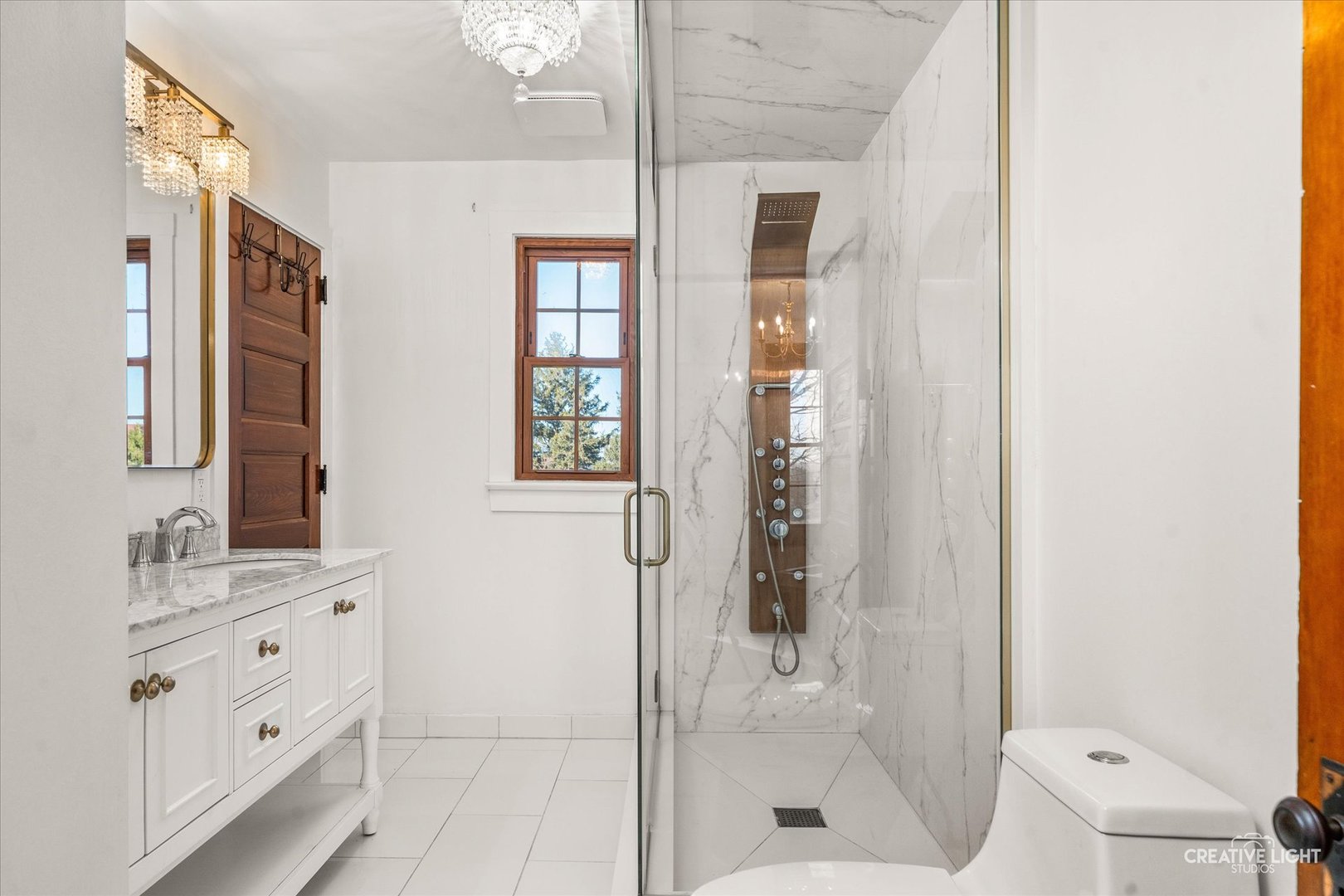 10256 Somonauk Road Hinckley, IL 60520 - Photo 15 of 44 a bathroom with a shower sink and mirror