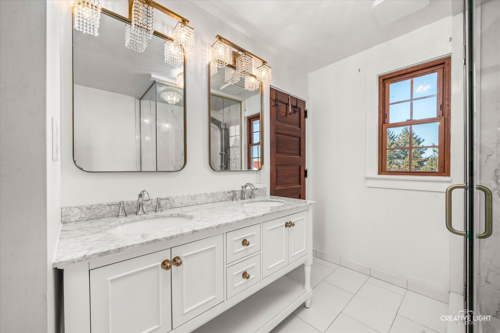 10256 Somonauk Road Hinckley, IL 60520 - Photo 16 of 44 a bathroom with a double vanity sink a mirror and a shower