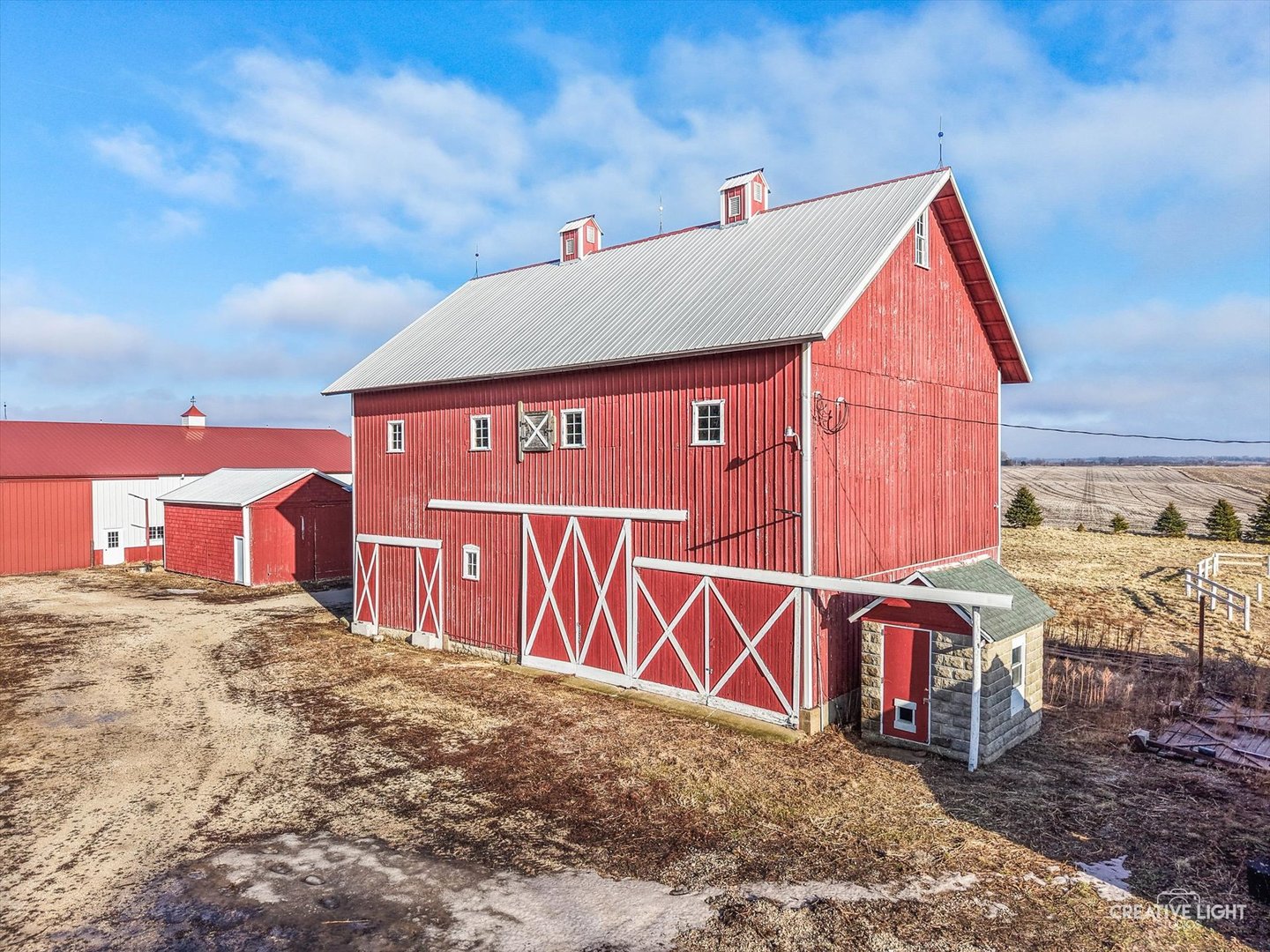 10256 Somonauk Road Hinckley, IL 60520 - Photo 2 of 44 a view of a street sign under a large tree