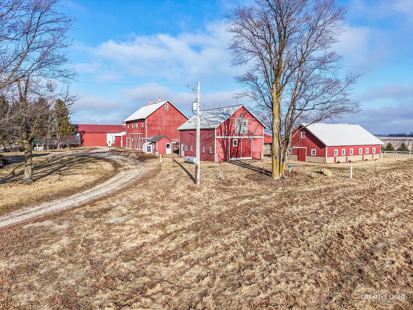 10256 Somonauk Road Hinckley, IL 60520 - Photo 26 of 44 a view of residential houses with yard and covered with snow