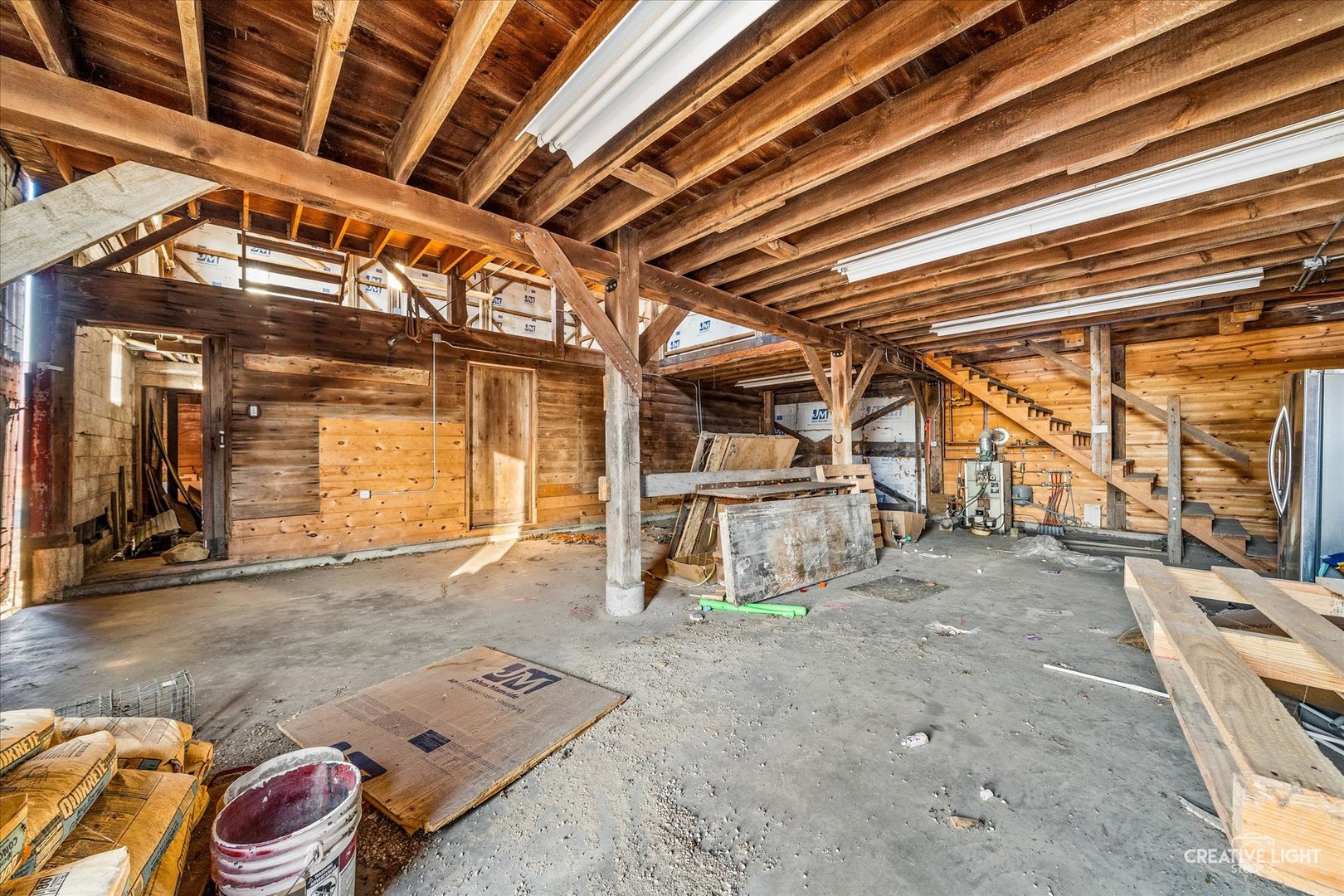 10256 Somonauk Road Hinckley, IL 60520 - Photo 32 of 44 a view of a storage room with wooden floor