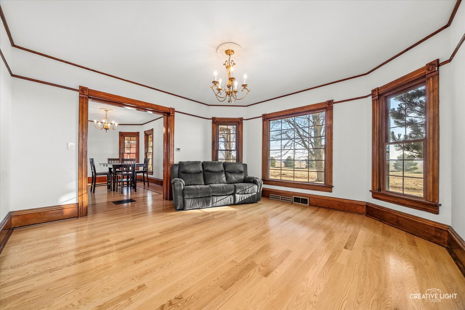 10256 Somonauk Road Hinckley, IL 60520 - Photo 7 of 44 a view of livingroom with furniture chandelier and wooden floor