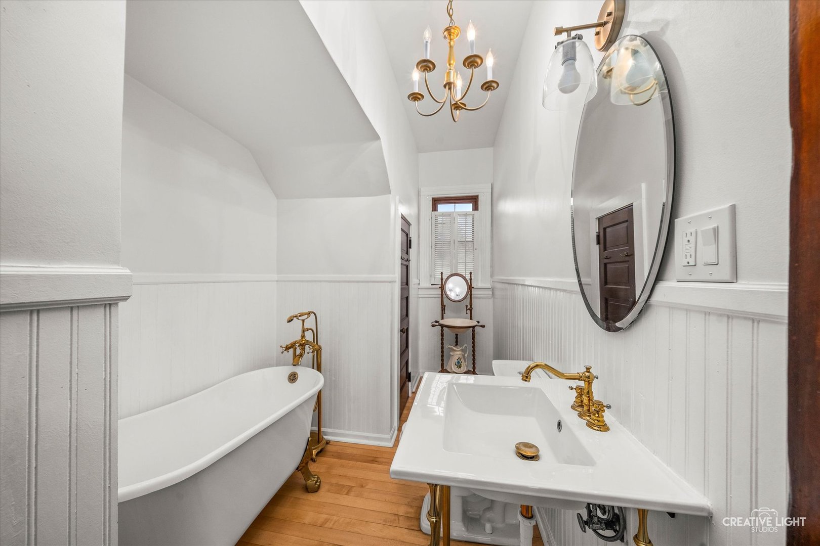 10256 Somonauk Road Hinckley, IL 60520 - Photo 8 of 44 a bathroom with a sink a bathtub and a mirror