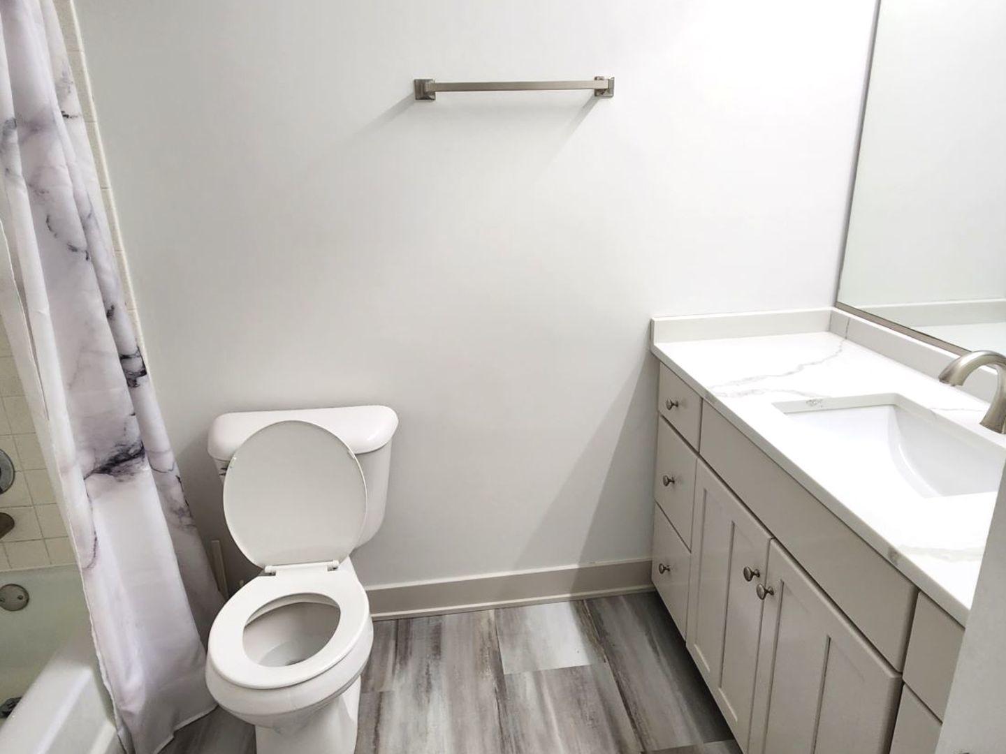 1500 Robin Circle, Unit 417 Hoffman Estates, IL 60169 - Photo 13 of 21 a bathroom with a sink a toilet and a mirror