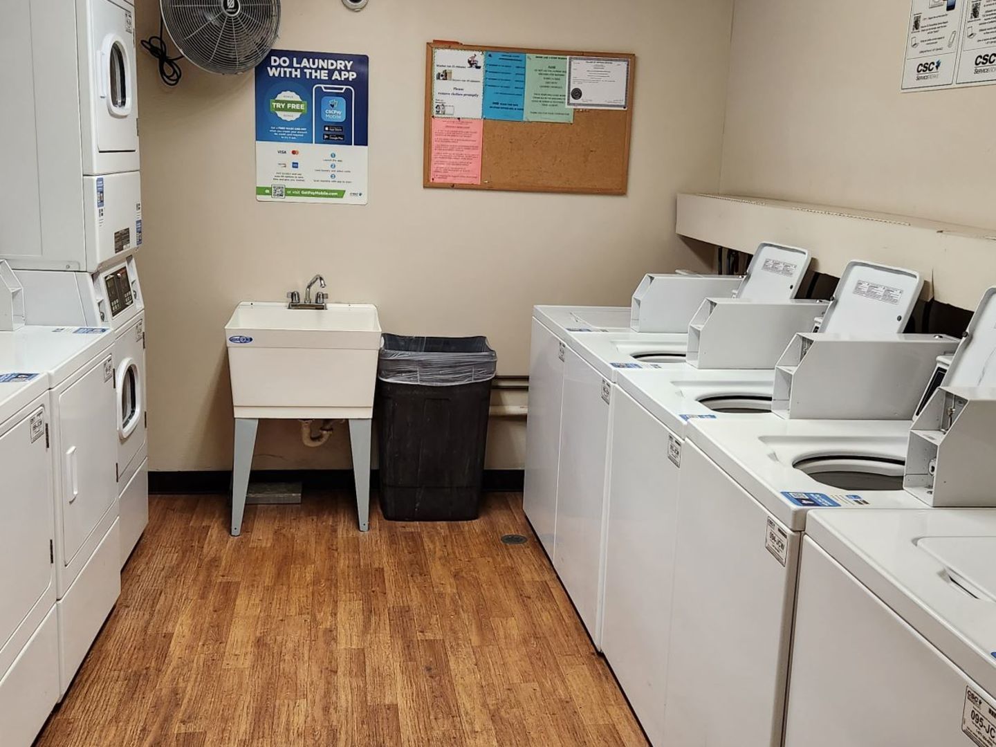 1500 Robin Circle, Unit 417 Hoffman Estates, IL 60169 - Photo 18 of 21 a utility room with a sink a chair and wooden floor
