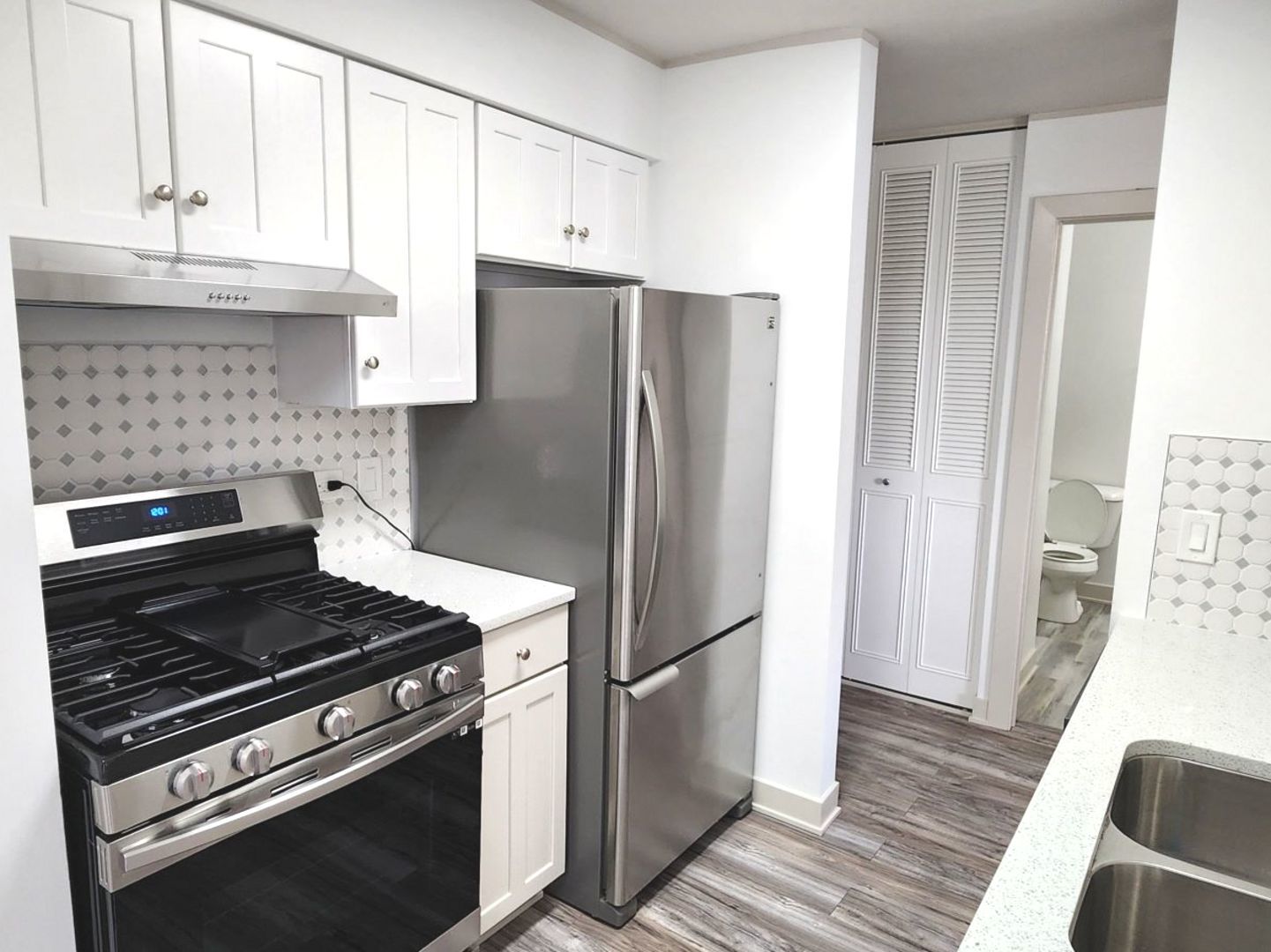 1500 Robin Circle, Unit 417 Hoffman Estates, IL 60169 - Photo 2 of 21 a kitchen with stainless steel appliances granite countertop a refrigerator and a stove