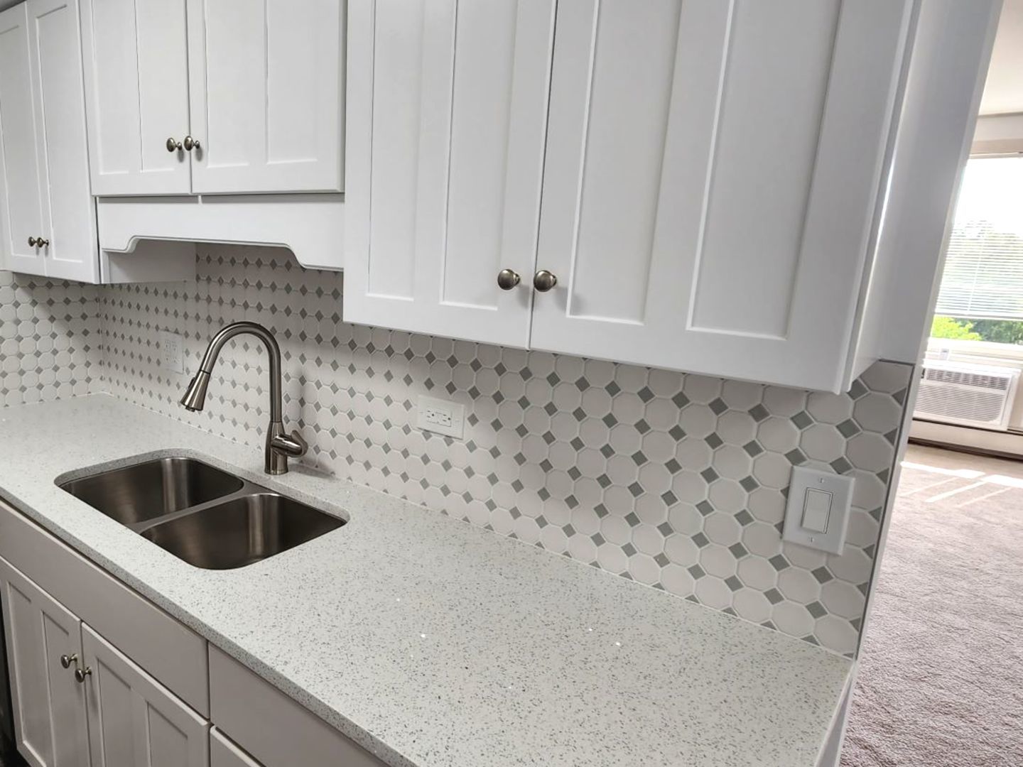 1500 Robin Circle, Unit 417 Hoffman Estates, IL 60169 - Photo 4 of 21 a kitchen with a sink and cabinets