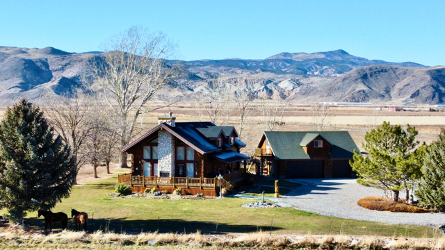 76 Highway 118 Monroe, UT 84754 - Photo 2 of 76 View of front of house featuring log exterior, a front lawn, a rural view, and a chimney