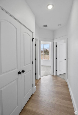 412 West 3025th Street South Logan, UT 84321 - Photo 28 of 34 Corridor with light wood-style flooring and baseboards
