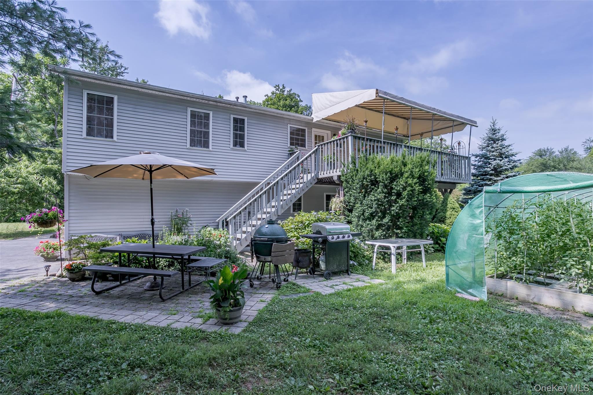 300 Mountain Lodge Road Monroe, NY 10950 - Photo 39 of 41 Back of house with a patio, a garden, a lawn, outdoor dining area, and a deck