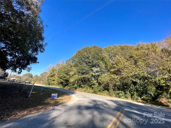 a view of a road with a yard