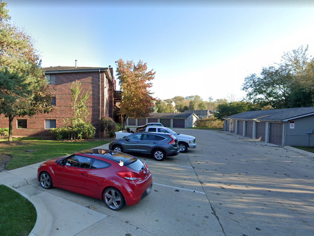 1350 Brook Street, Unit J St. Charles, IL 60174 - Photo 13 of 13 a car parked in front of a house