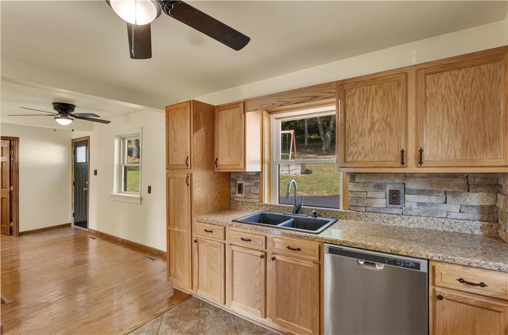 1585 Rte 481 Charleroi, PA 15022 - Photo 14 of 37 a kitchen with stainless steel appliances granite countertop a stove a sink and a refrigerator