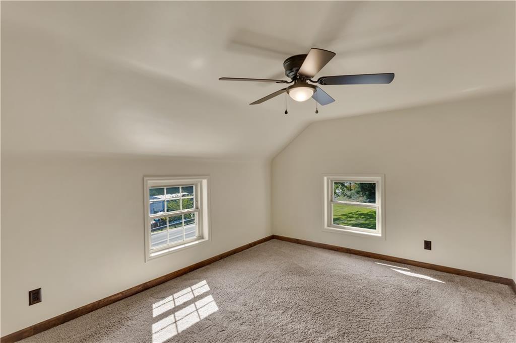 1585 Rte 481 Charleroi, PA 15022 - Photo 26 of 37 an empty room with windows and fan