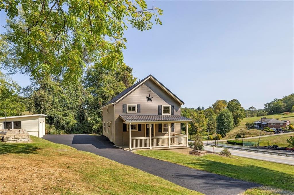 1585 Rte 481 Charleroi, PA 15022 - Photo 3 of 37 a view of a house with a big yard and large trees