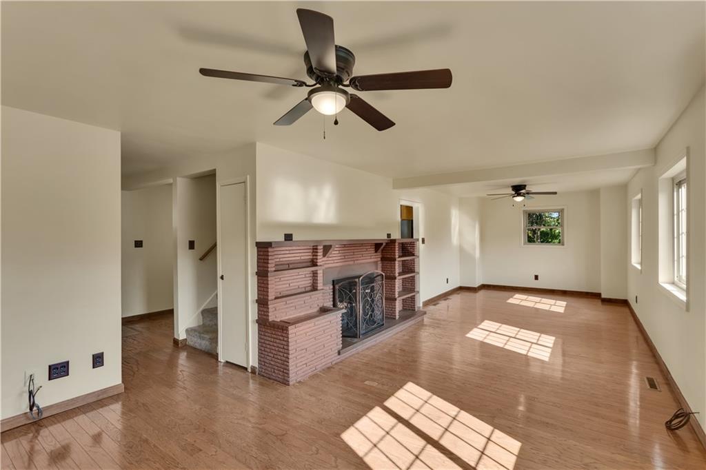 1585 Rte 481 Charleroi, PA 15022 - Photo 8 of 37 a view of livingroom with hardwood floor and a ceiling fan