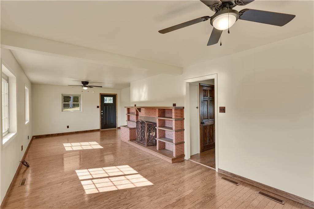 1585 Rte 481 Charleroi, PA 15022 - Photo 10 of 37 a view of a livingroom with furniture and a ceiling fan
