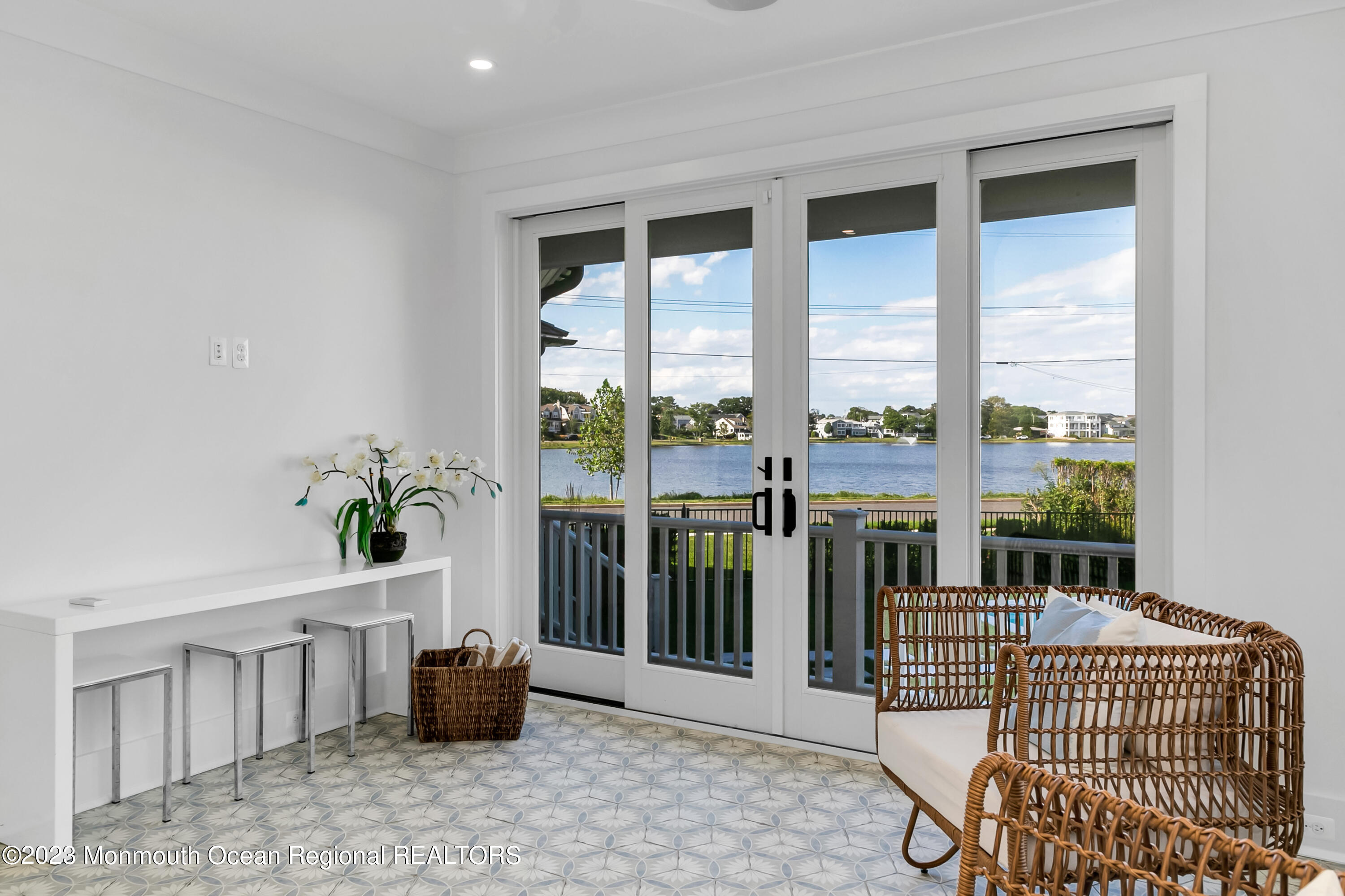 65 South Boulevard Spring Lake, NJ 07762 - Photo 32 of 80 a living room with furniture and a floor to ceiling window