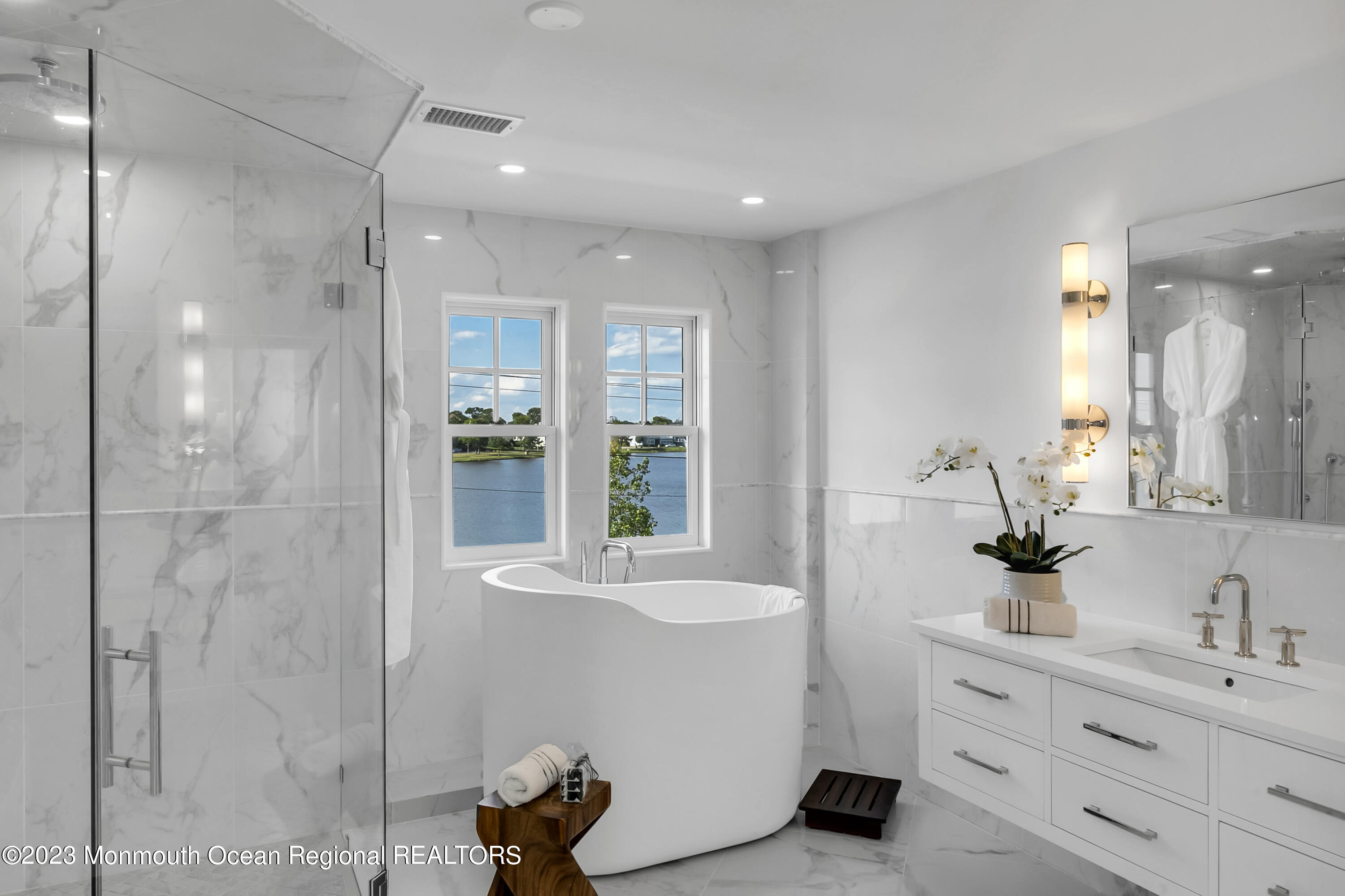 65 South Boulevard Spring Lake, NJ 07762 - Photo 48 of 80 a bathroom with a sink shower and a mirror