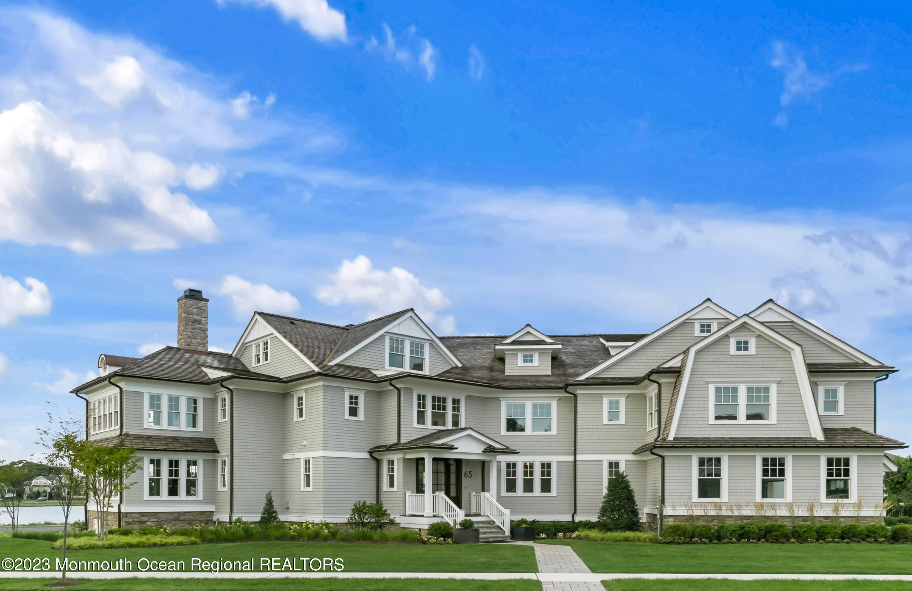 65 South Boulevard Spring Lake, NJ 07762 - Photo 5 of 80 a front view of a building with a garden